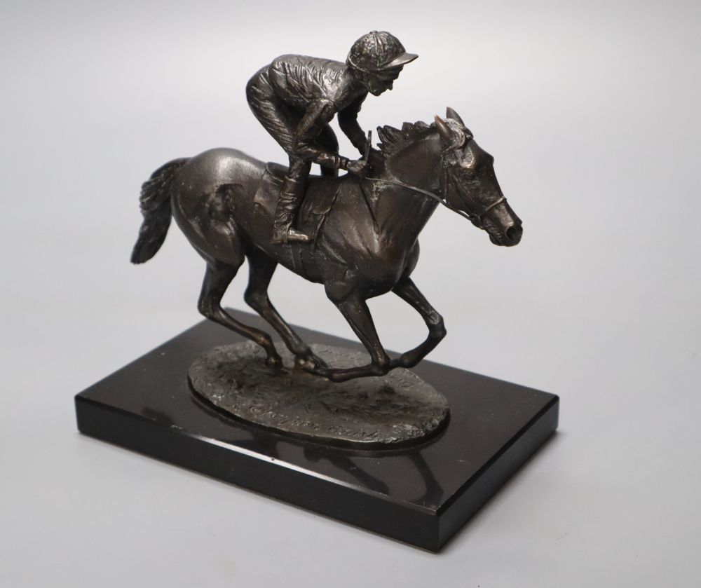 David Cornell, 1985. A cast bronze racehorse and jockey, entitled Champion Finish, on slate plinth, height 20cm